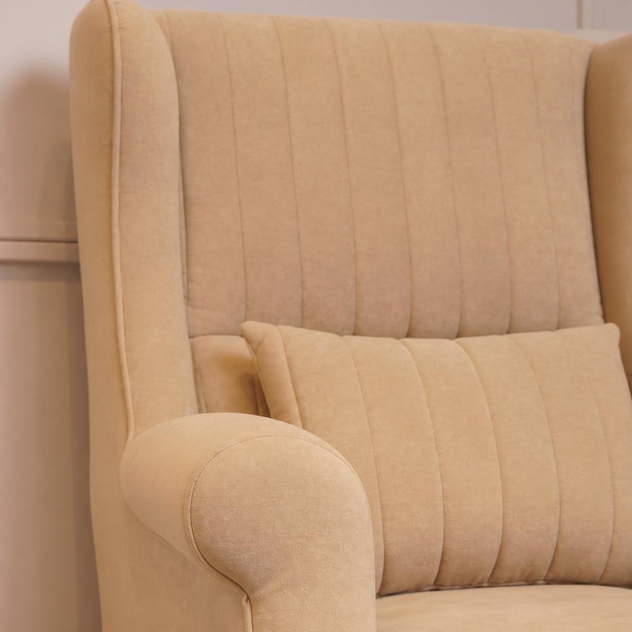 Close-up of a cream upholstered chair