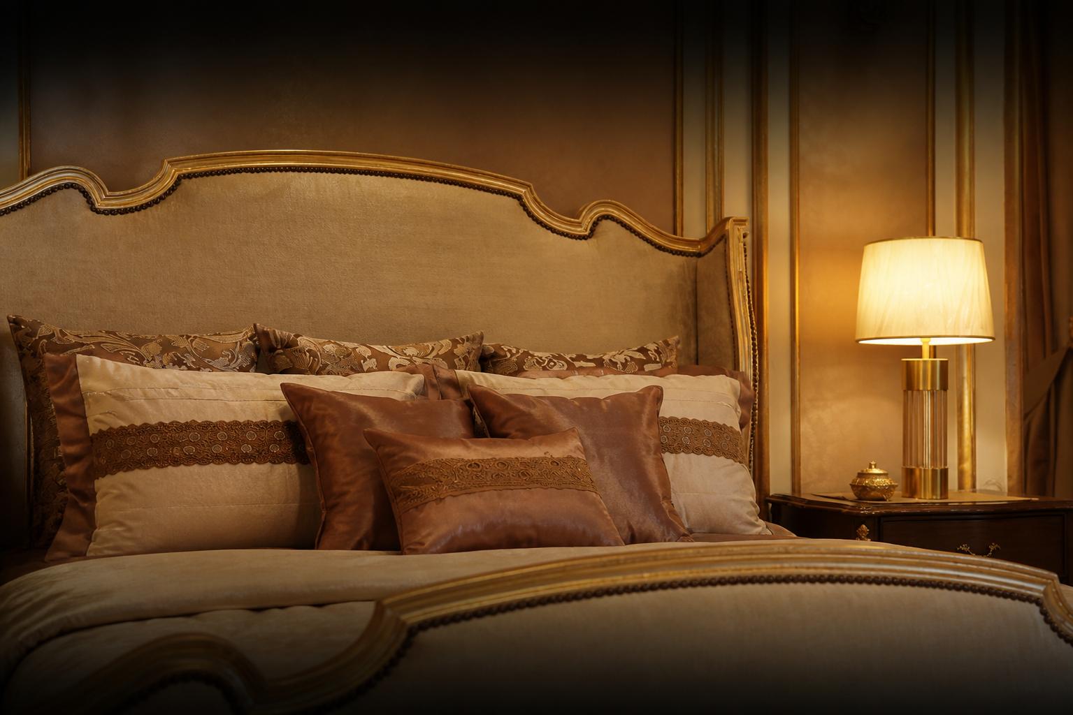 Close-up of a cream and gold bedroom suite